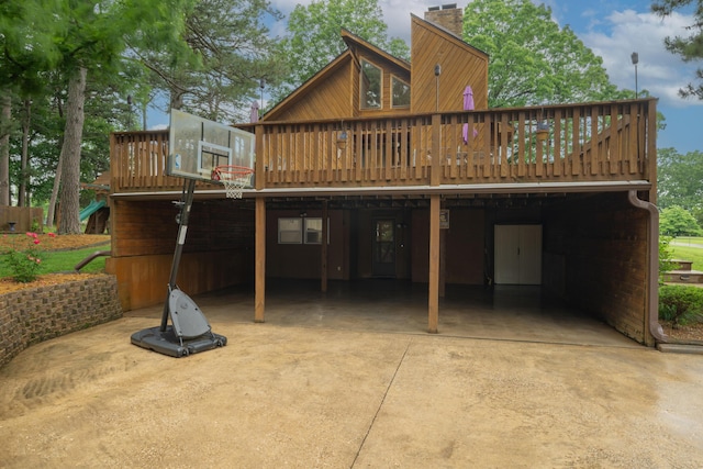 10703 Lawrence Unit 2230, Monett, MO 65708 - rear view of property featuring a chimney, a deck, and concrete driveway