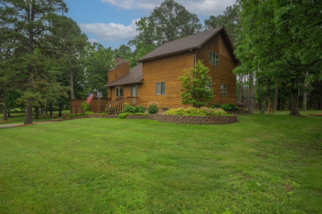 10703 Lawrence Unit 2230, Monett, MO 65708 - view of property exterior with a chimney and a lawn