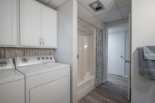 10703 Lawrence Unit 2230, Monett, MO 65708 - washroom with washer and clothes dryer and dark wood finished floors