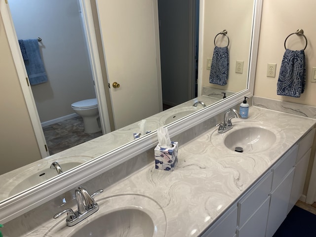 2704 Jennifer Dr, West Plains, MO 65775 - bathroom with double vanity and toilet