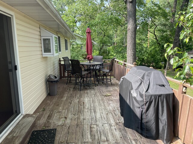 2704 Jennifer Dr, West Plains, MO 65775 - wooden terrace with outdoor dining space, grilling area, and view of scattered trees