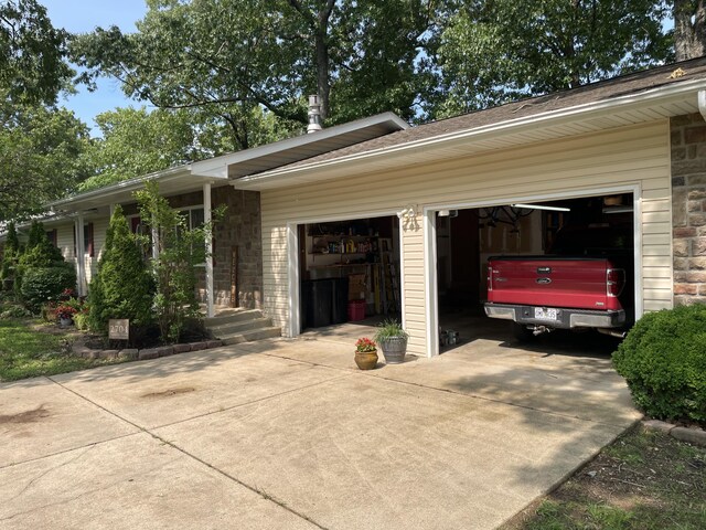 2704 Jennifer Dr, West Plains, MO 65775 - view of side of property with concrete driveway and a garage