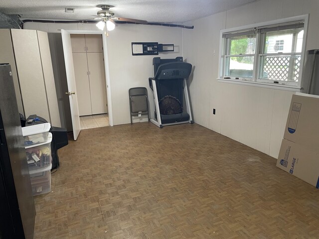 2704 Jennifer Dr, West Plains, MO 65775 - below grade area featuring ceiling fan and a textured ceiling