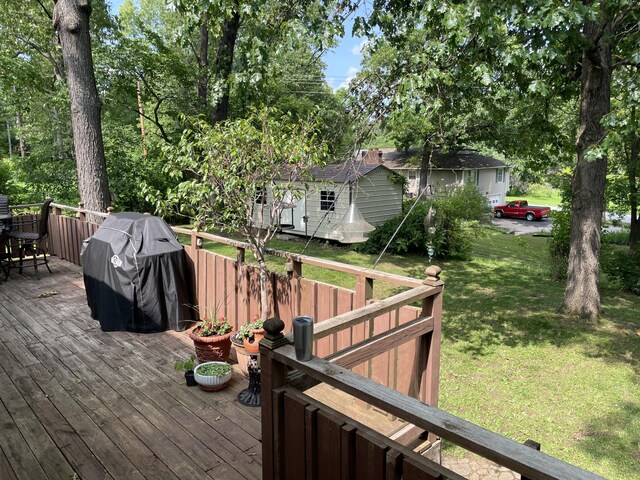 2704 Jennifer Dr, West Plains, MO 65775 - wooden terrace featuring a lawn, outdoor dining area, and area for grilling