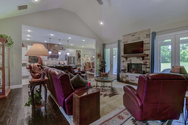 722 Seven Pines Dr, Saddlebrooke, MO 65630 - living area featuring a fireplace, plenty of natural light, french doors, recessed lighting, and wood finished floors
