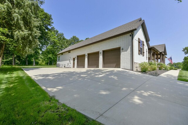 722 Seven Pines Dr, Saddlebrooke, MO 65630 - view of side of property with a yard, a shingled roof, brick siding, and stone siding