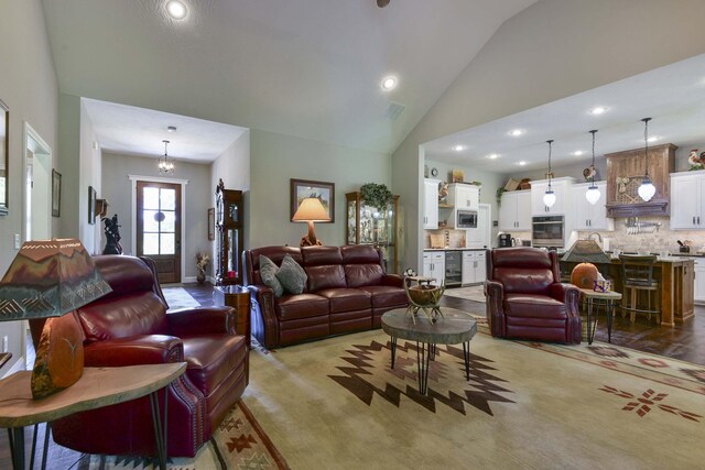 722 Seven Pines Dr, Saddlebrooke, MO 65630 - living area featuring beverage cooler, recessed lighting, and lofted ceiling