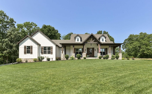 722 Seven Pines Dr, Saddlebrooke, MO 65630 - view of front of home with board and batten siding, a front yard, and covered porch