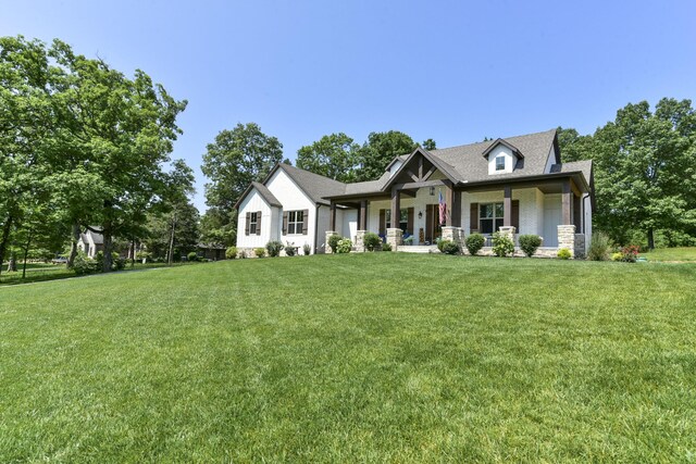 722 Seven Pines Dr, Saddlebrooke, MO 65630 - view of front of house with a front lawn and covered porch