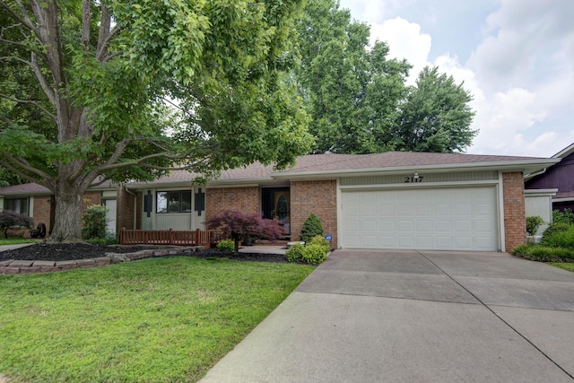 2117 E Wornall Pl, Springfield, MO 65804 - ranch-style home featuring brick siding, an attached garage, concrete driveway, and a front yard