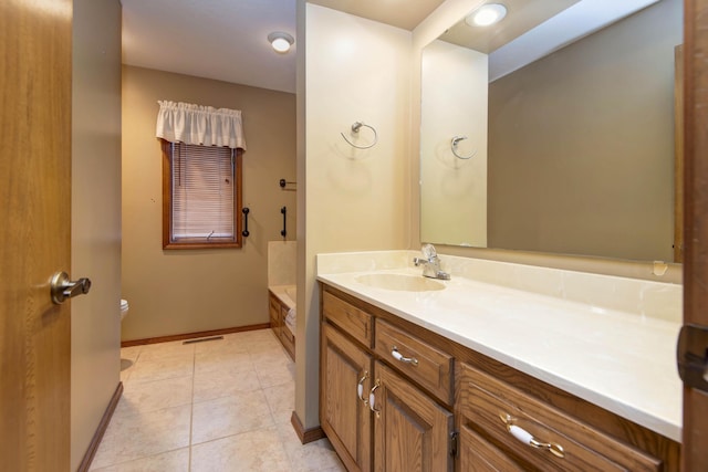 2117 E Wornall Pl, Springfield, MO 65804 - bathroom featuring vanity, a bath, and tile patterned floors