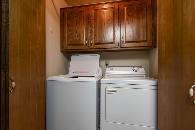2117 E Wornall Pl, Springfield, MO 65804 - laundry area featuring washing machine and clothes dryer and cabinet space
