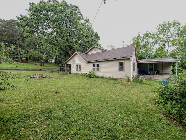 1010 Pine St, Cabool, MO 65689 - back of property with a yard and roof with shingles
