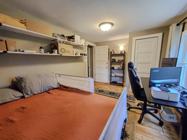 1010 Pine St, Cabool, MO 65689 - bedroom with light wood-style floors and an office area