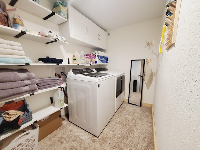 1010 Pine St, Cabool, MO 65689 - laundry room featuring independent washer and dryer, cabinet space, and light carpet