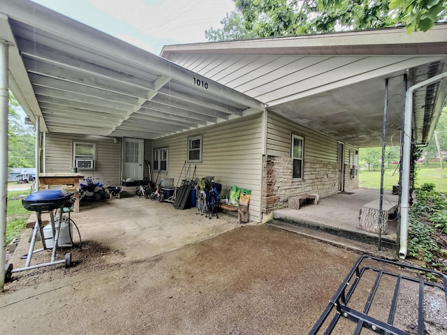 1010 Pine St, Cabool, MO 65689 - view of patio / terrace with a carport, cooling unit, and area for grilling