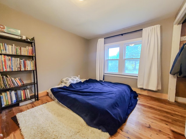 1010 Pine St, Cabool, MO 65689 - bedroom with wood finished floors and baseboards