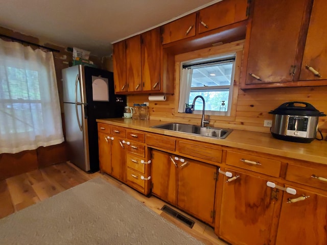 1010 Pine St, Cabool, MO 65689 - kitchen with a sink, brown cabinetry, and light countertops