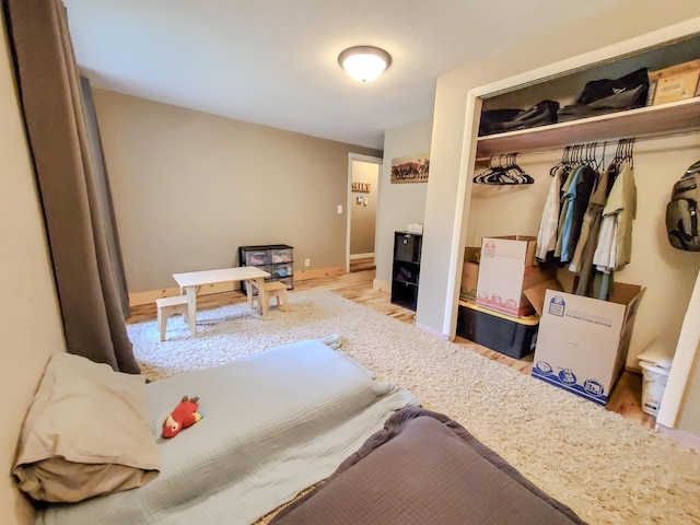 1010 Pine St, Cabool, MO 65689 - bedroom featuring a closet, wood finished floors, and baseboards