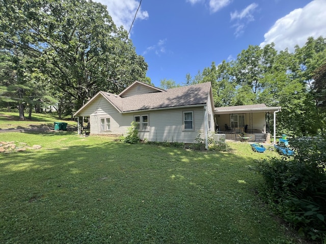 1010 Pine St, Cabool, MO 65689 - view of property exterior with a lawn, a shingled roof, and covered porch