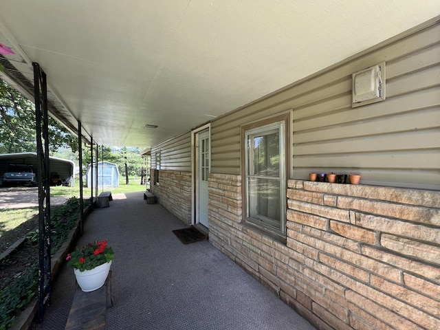 1010 Pine St, Cabool, MO 65689 - view of patio / terrace featuring a shed