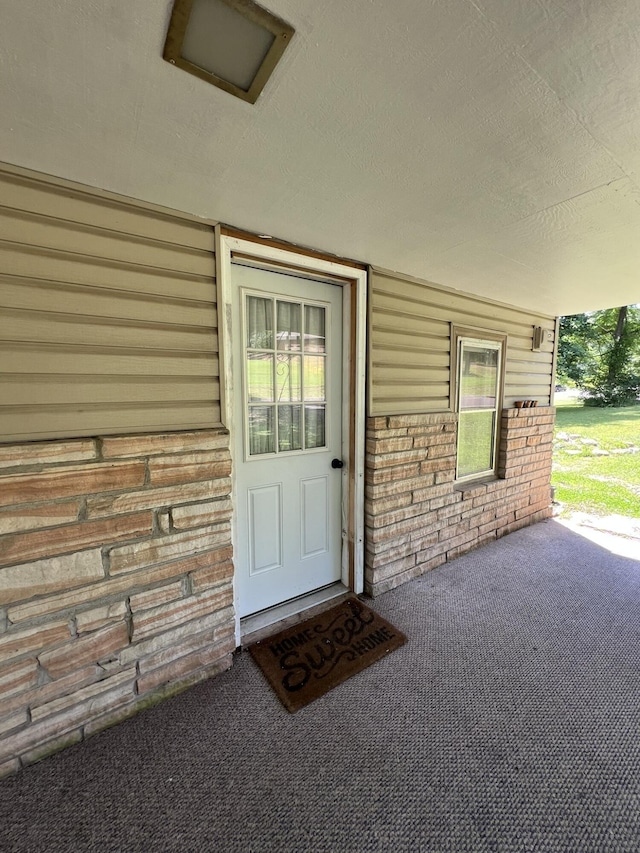1010 Pine St, Cabool, MO 65689 - view of exterior entry featuring brick siding