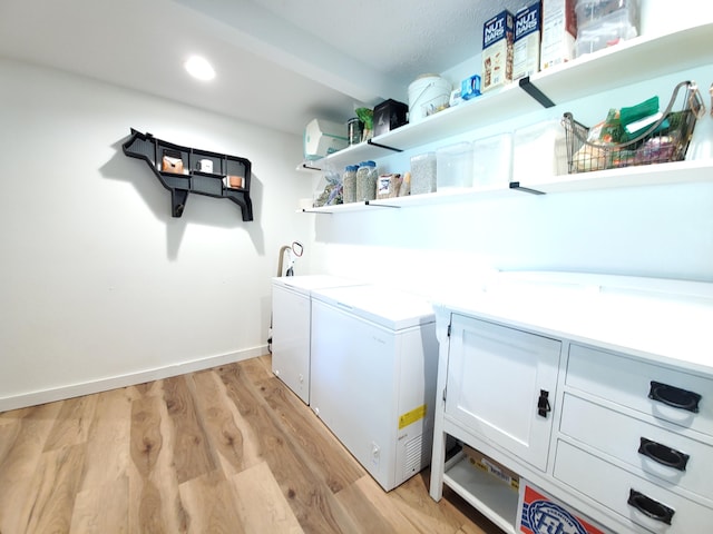 1010 Pine St, Cabool, MO 65689 - washroom featuring light wood-style flooring, cabinet space, washer and dryer, and recessed lighting