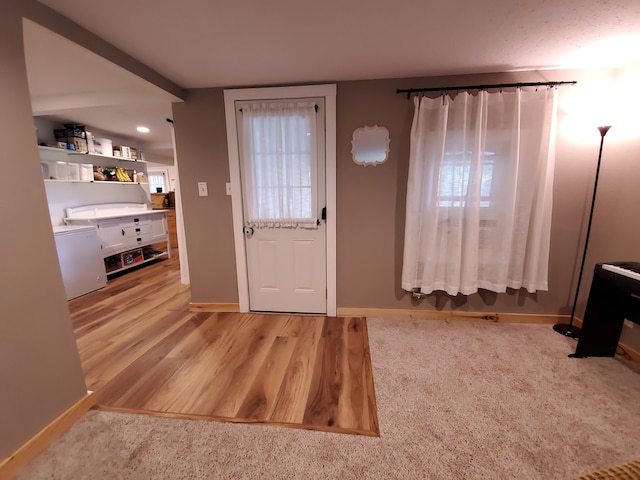 1010 Pine St, Cabool, MO 65689 - entryway featuring baseboards and light wood finished floors