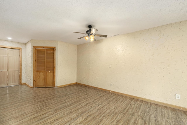 247 S Jefferson St, Walnut Grove, MO 65770 - empty room featuring light wood finished floors, ceiling fan, a textured ceiling, a textured wall, and baseboards