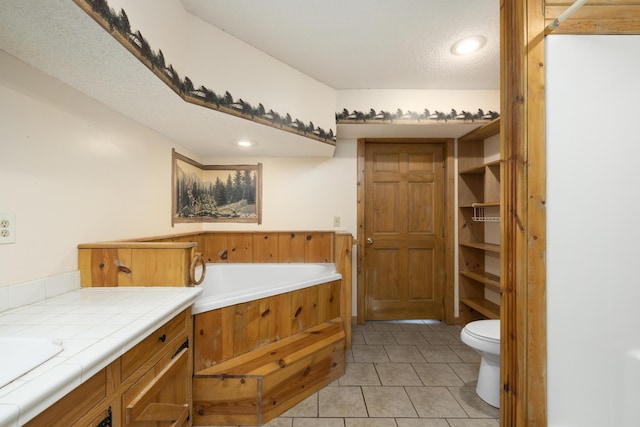 247 S Jefferson St, Walnut Grove, MO 65770 - full bath featuring a garden tub, tile patterned floors, toilet, vanity, and recessed lighting