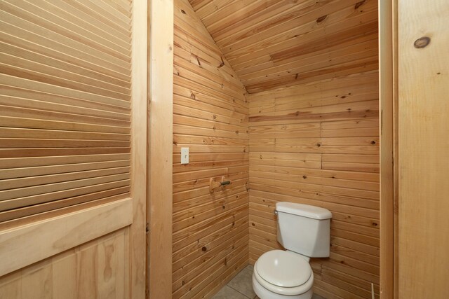 247 S Jefferson St, Walnut Grove, MO 65770 - bathroom featuring toilet, vaulted ceiling, wooden walls, tile patterned flooring, and wooden ceiling
