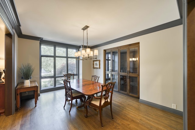 3596 E Montrose Ct, Springfield, MO 65809 - dining room featuring ornamental molding, a chandelier, wood finished floors, and baseboards