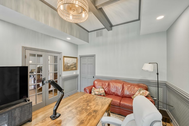3596 E Montrose Ct, Springfield, MO 65809 - living area with wainscoting, french doors, a high ceiling, wood finished floors, and recessed lighting