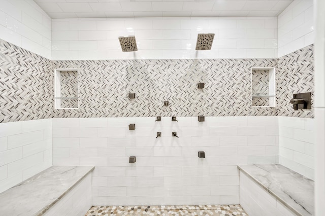 3596 E Montrose Ct, Springfield, MO 65809 - bathroom featuring tiled shower and tile walls