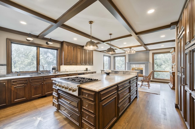 3596 E Montrose Ct, Springfield, MO 65809 - kitchen featuring stainless steel gas cooktop, a sink, decorative backsplash, coffered ceiling, and beamed ceiling