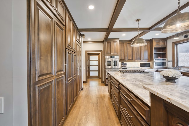 3596 E Montrose Ct, Springfield, MO 65809 - kitchen with open shelves, tasteful backsplash, stainless steel appliances, light wood-style floors, and pendant lighting