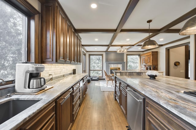 3596 E Montrose Ct, Springfield, MO 65809 - kitchen featuring a sink, light stone counters, light wood-style flooring, recessed lighting, and backsplash