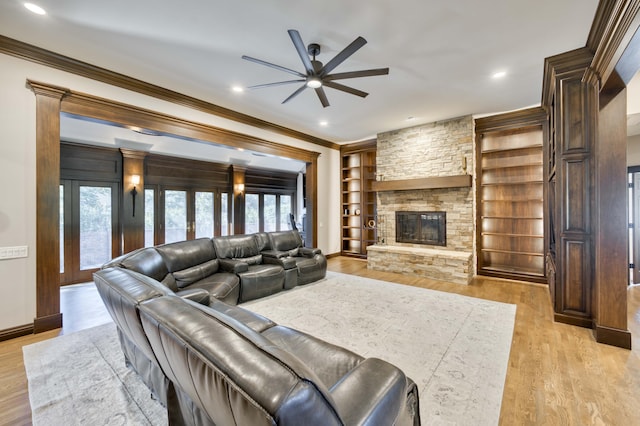 3596 E Montrose Ct, Springfield, MO 65809 - living area featuring a ceiling fan, ornamental molding, built in shelves, plenty of natural light, and light wood-type flooring