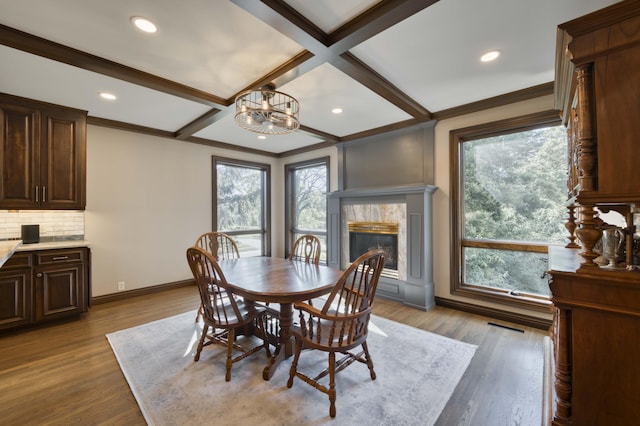 3596 E Montrose Ct, Springfield, MO 65809 - dining room with a fireplace, healthy amount of natural light, baseboards, a chandelier, and coffered ceiling