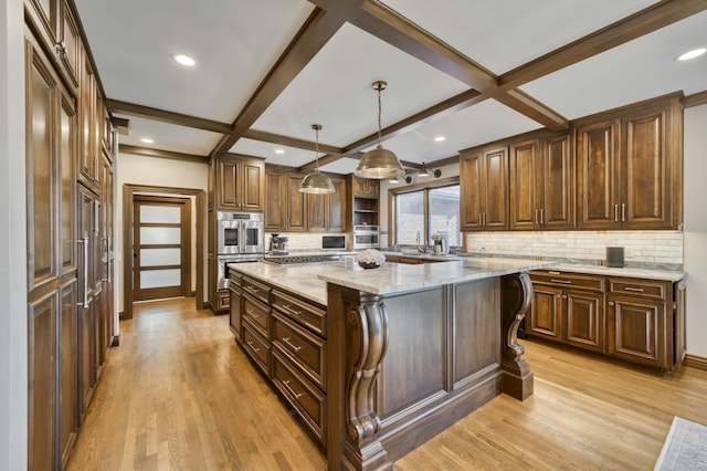 3596 E Montrose Ct, Springfield, MO 65809 - kitchen featuring open shelves, tasteful backsplash, a center island, light wood-type flooring, and light stone counters