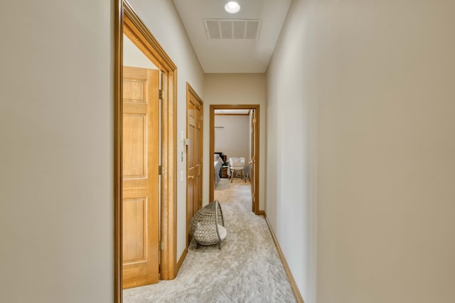3596 E Montrose Ct, Springfield, MO 65809 - corridor featuring light colored carpet and baseboards