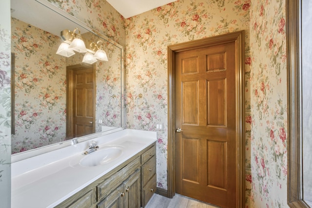 3596 E Montrose Ct, Springfield, MO 65809 - bathroom with vanity, wood finished floors, and wallpapered walls