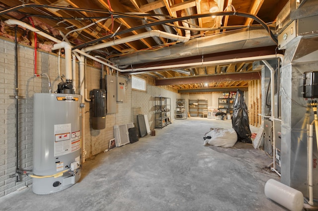 3596 E Montrose Ct, Springfield, MO 65809 - basement featuring gas water heater, a central vacuum unit, and brick wall