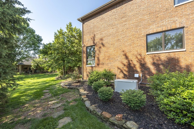 3596 E Montrose Ct, Springfield, MO 65809 - view of side of property featuring brick siding and a lawn