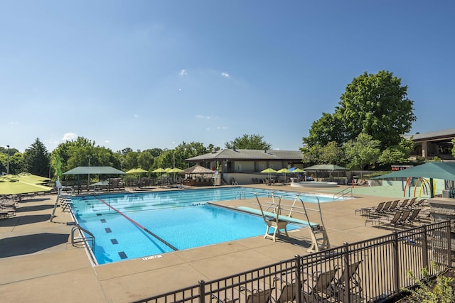 3596 E Montrose Ct, Springfield, MO 65809 - community pool with a patio area and view of wooded area