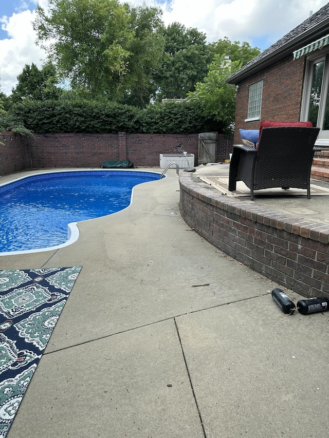 3596 E Montrose Ct, Springfield, MO 65809 - view of swimming pool with a fenced backyard and a patio