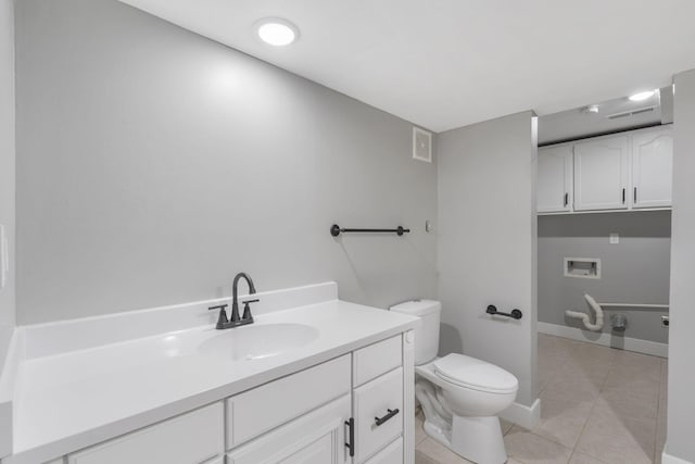5715 S Clay Ave, Springfield, MO 65810 - bathroom with toilet, tile patterned flooring, and vanity