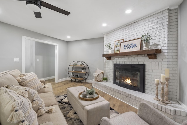 5715 S Clay Ave, Springfield, MO 65810 - living room with a fireplace, ceiling fan, recessed lighting, wood finished floors, and baseboards