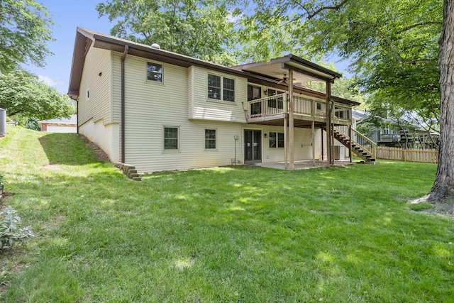 5715 S Clay Ave, Springfield, MO 65810 - back of property with ceiling fan, stairs, a deck, and a patio area