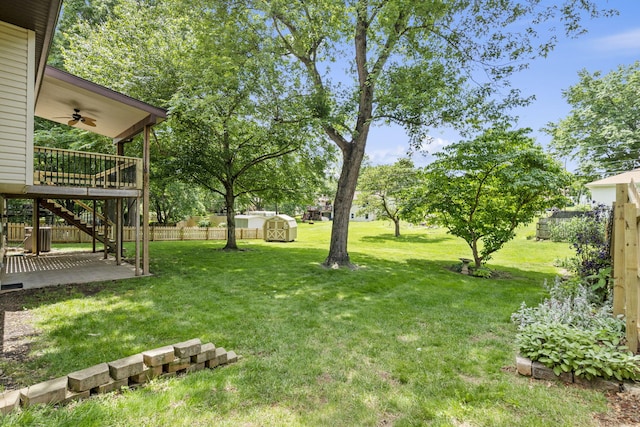 5715 S Clay Ave, Springfield, MO 65810 - view of yard featuring ceiling fan, stairs, and a patio area